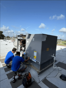 Martin's technicians servicing a rooftop HVAC unit