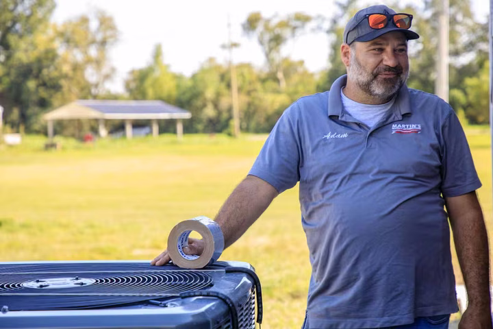 Martin's technician servicing an outdoor AC condenser